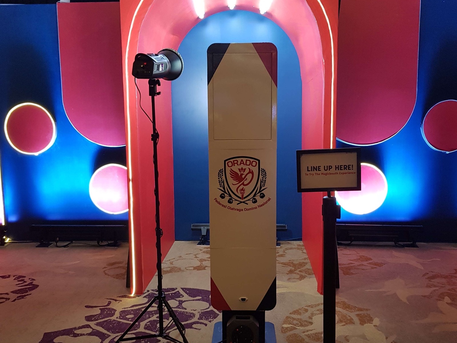 Full campaign MagicBooth setup with custom backdrop and lighting